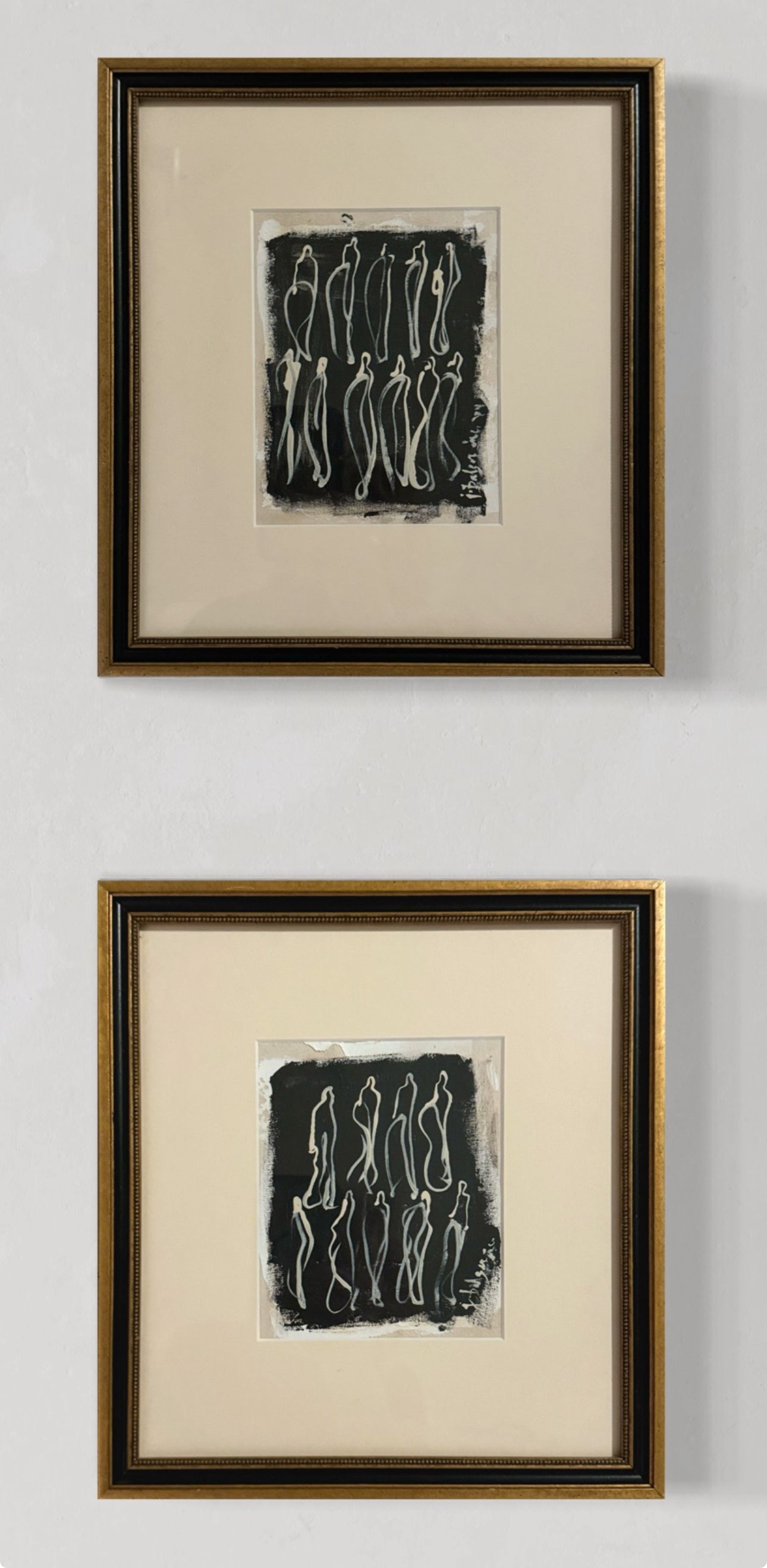 Pair of Black & Gold Framed Cream Figures on Black Unstretched Canvas