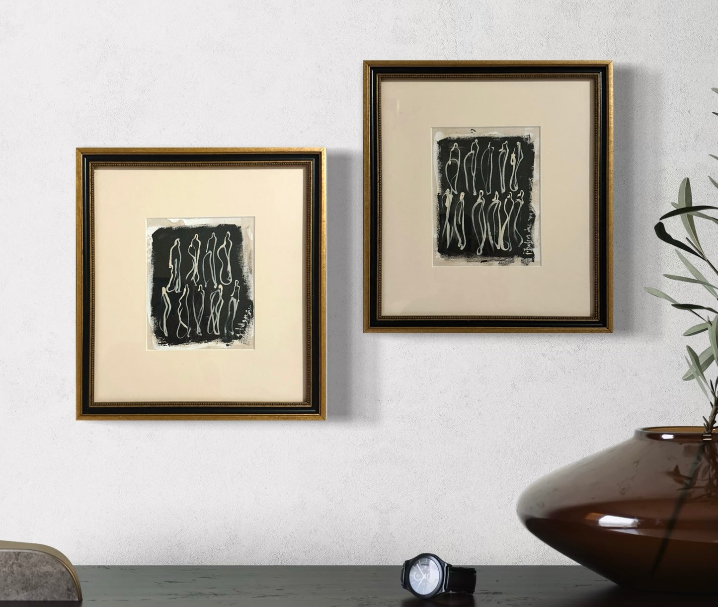 Pair of Black & Gold Framed Cream Figures on Black Unstretched Canvas